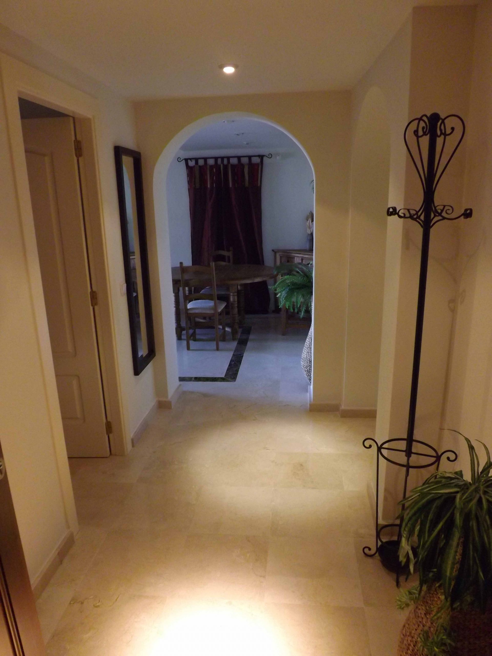 spacious hallway in the apartment leading to the living area